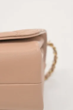 Blush matelassé calfskin mini pearl chain flap bag