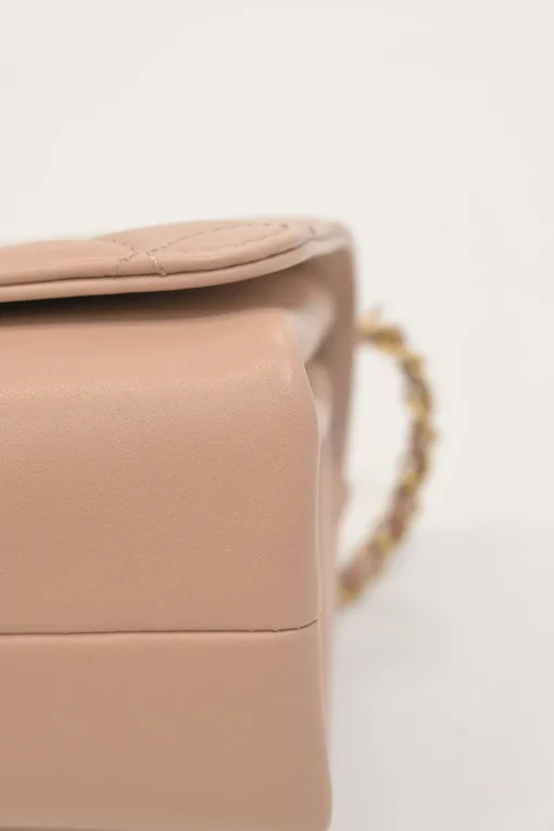 Blush matelassé calfskin mini pearl chain flap bag