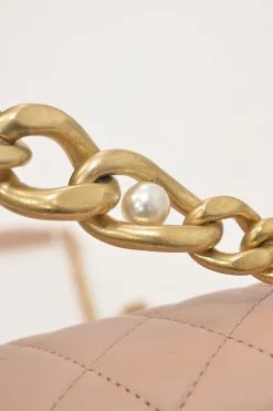 Blush matelassé calfskin mini pearl chain flap bag