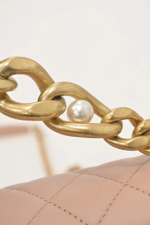 Blush matelassé calfskin mini pearl chain flap bag