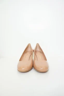 Blush peach almond toe pumps with a stacked gold-tone sculpted block heel
