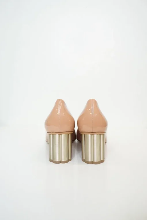 Blush peach almond toe pumps with a stacked gold-tone sculpted block heel