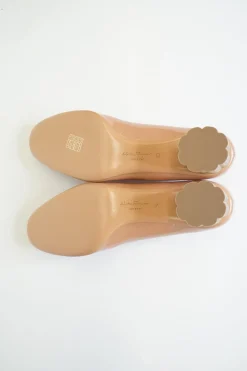 Blush peach almond toe pumps with a stacked gold-tone sculpted block heel