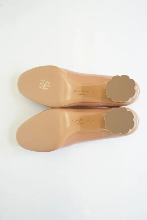 Blush peach almond toe pumps with a stacked gold-tone sculpted block heel