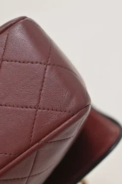 Bordeaux matelassé lambskin CC flap shoulder bag with with 24-karat gold-plated hardware