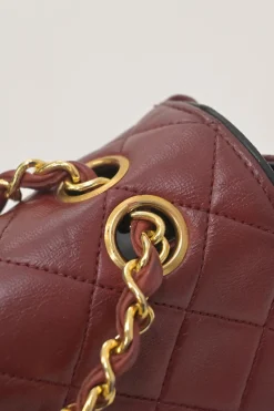 Bordeaux matelassé lambskin CC flap shoulder bag with with 24-karat gold-plated hardware