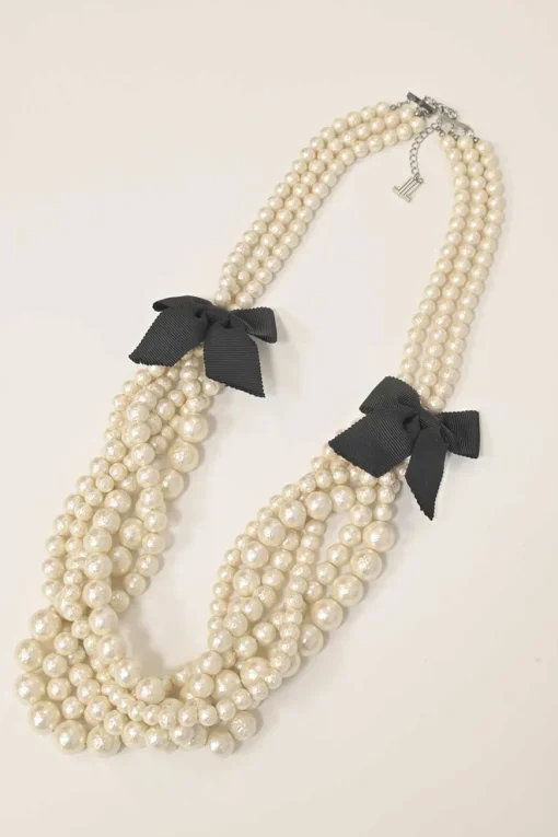 Bow-embellished resin multi-strand faux pearl necklace with lobster clasp closure