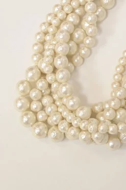 Bow-embellished resin multi-strand faux pearl necklace with lobster clasp closure