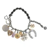 Brass and grosgrain ribbon mixed-metal lucky charm double-strand bracelet with spring clasp closure