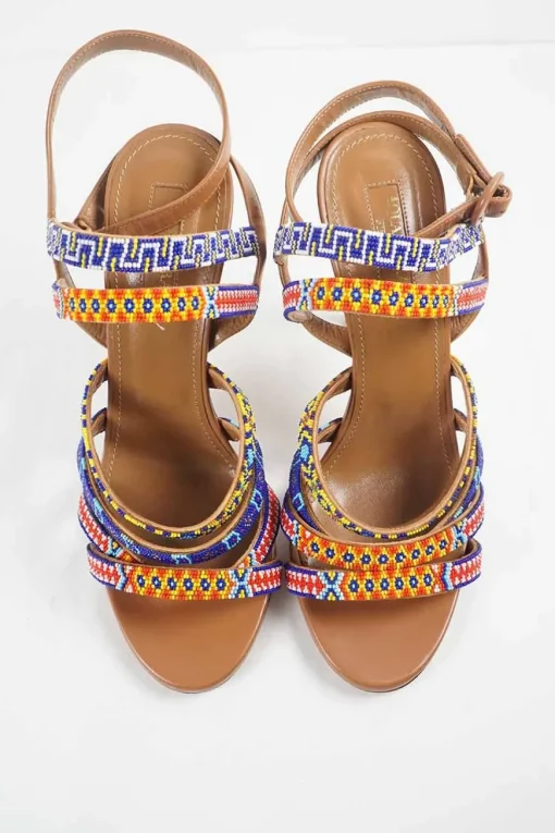 Brown beaded almond toe strappy heeled Masai sandals with adjustable buckle ankle strap