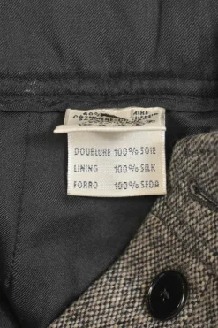 Brown cashmere-blend tweed pleat-front tapered pants with extended tab closure, waist adjusters, and pull tab cuffs