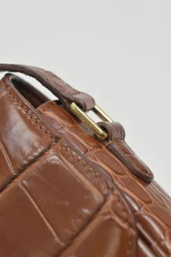 Brown croc-embossed calfskin tassel flap bag with adjustable shoulder strap