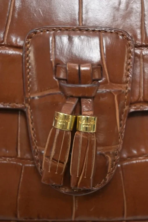 Brown croc-embossed calfskin tassel flap bag with adjustable shoulder strap