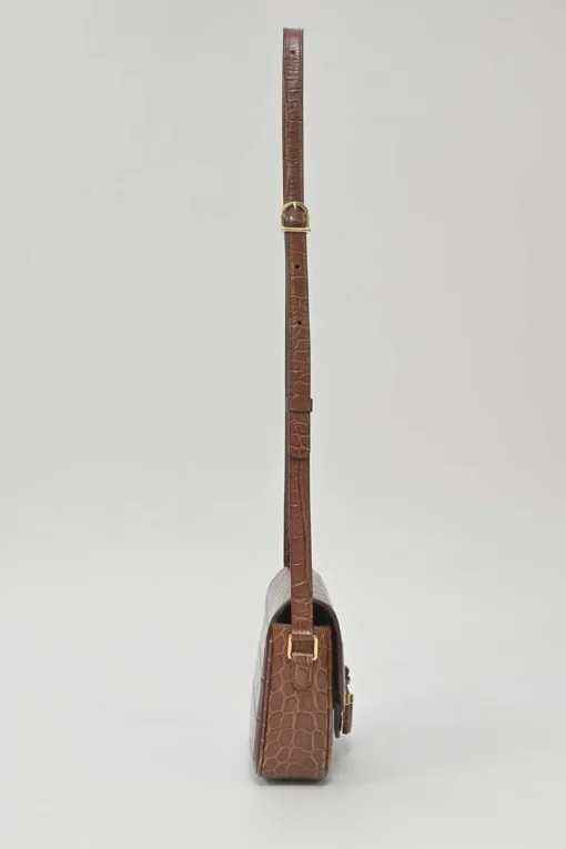 Brown croc-embossed calfskin tassel flap bag with adjustable shoulder strap