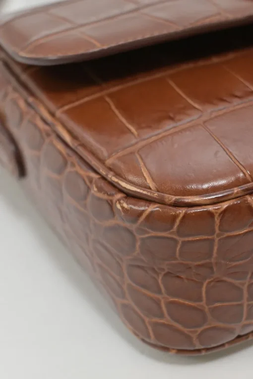 Brown croc-embossed calfskin tassel flap bag with adjustable shoulder strap
