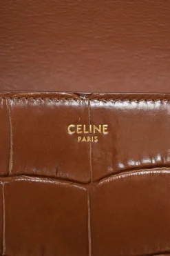 Brown croc-embossed calfskin tassel flap bag with adjustable shoulder strap