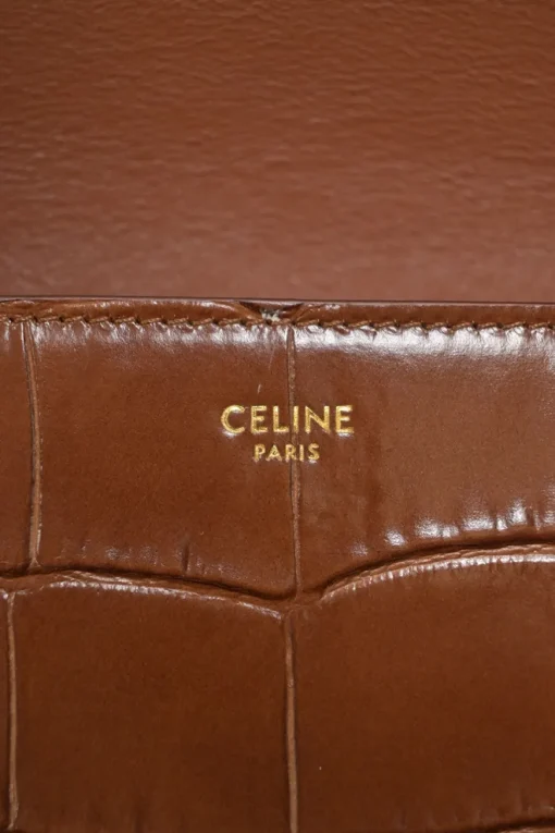 Brown croc-embossed calfskin tassel flap bag with adjustable shoulder strap