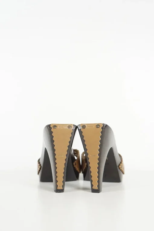 Brown laser-cut leather slip-on wooden block heel platform sandals featuring floral motif