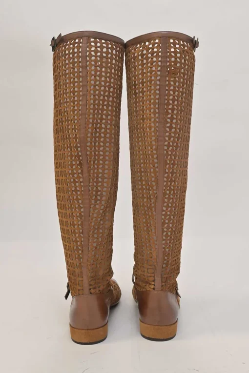 Brown laser-cut leather square-toe knee-high boots with buckle straps