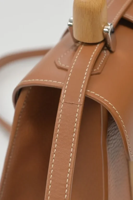 Brown leather and wood Goyardine Saïgon Structuré mini bag