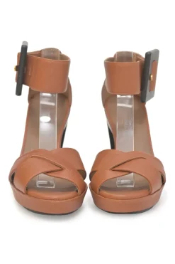 Brown leather block heel platform sandals with criss-cross vamp strap and buckle fastening