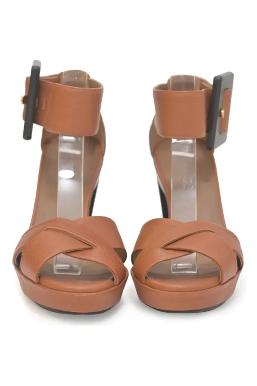 Brown leather block heel platform sandals with criss-cross vamp strap and buckle fastening