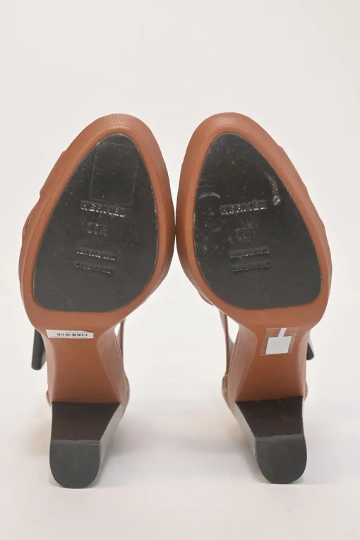 Brown leather block heel platform sandals with criss-cross vamp strap and buckle fastening