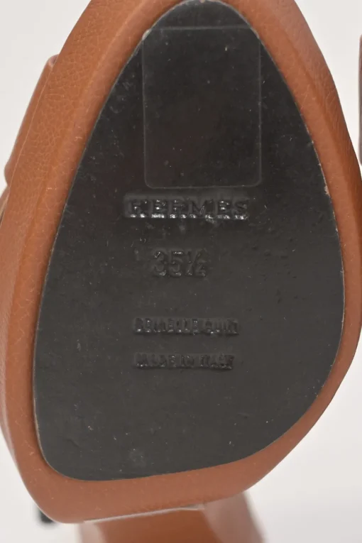Brown leather block heel platform sandals with criss-cross vamp strap and buckle fastening