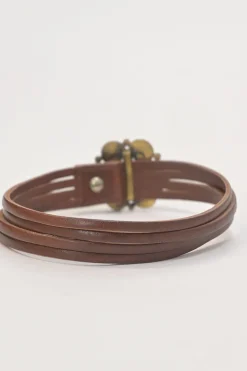 Brown leather choker featuring crystal and enamel-embellished flower pendant