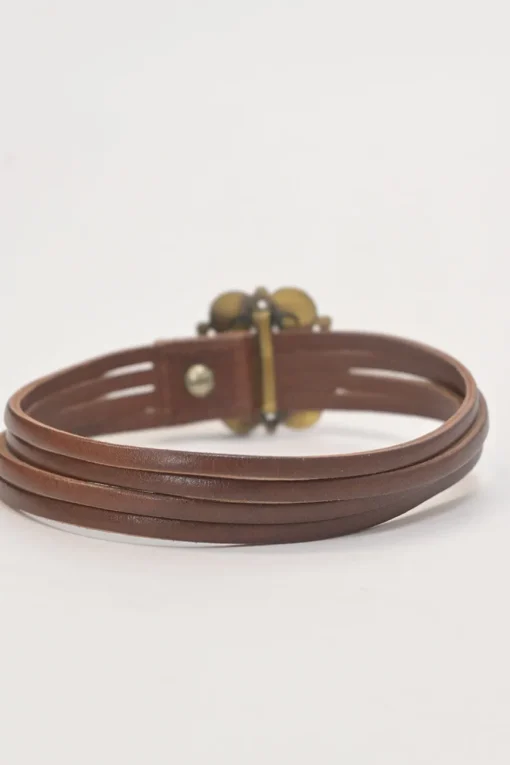 Brown leather choker featuring crystal and enamel-embellished flower pendant