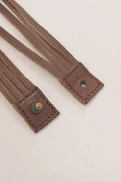 Brown leather choker featuring crystal and enamel-embellished flower pendant