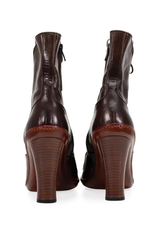 Brown leather high heel lace up pump boots with zipper fastening on the side