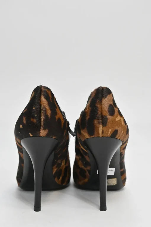 Brown leopard print calf hair and leather ankle booties with tassel zip fastening