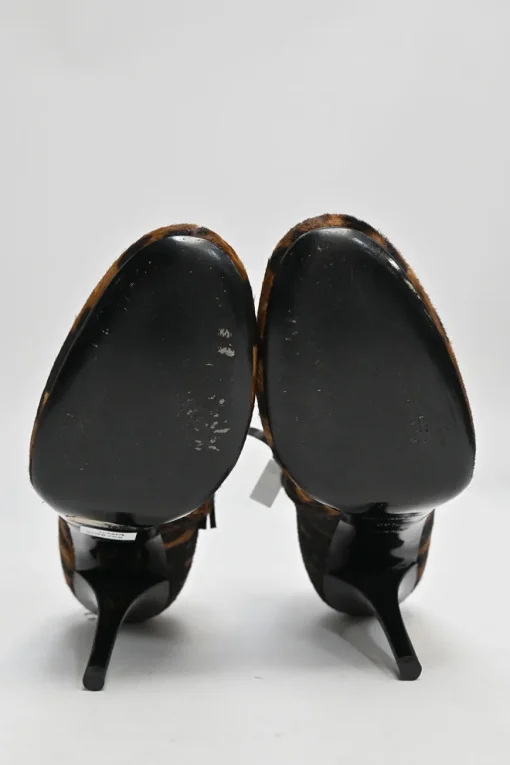 Brown leopard print calf hair and leather ankle booties with tassel zip fastening