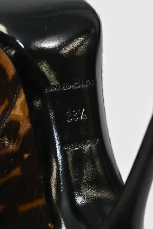 Brown leopard print calf hair and leather ankle booties with tassel zip fastening