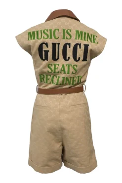 Brown monogram canvas and leather half-zip belted safari romper featuring rear slogan broderie motif