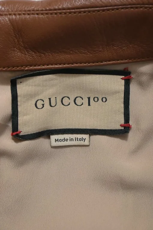 Brown monogram canvas and leather half-zip belted safari romper featuring rear slogan broderie motif