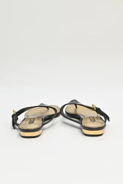Brown monogram-embossed patent leather No Doubt buckled thong sandals