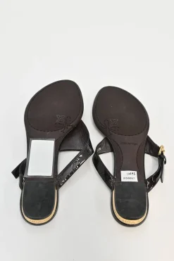 Brown monogram-embossed patent leather No Doubt buckled thong sandals