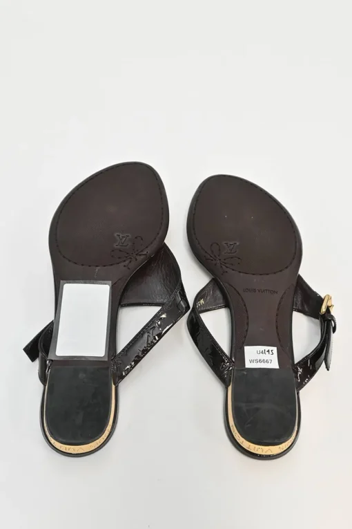 Brown monogram-embossed patent leather No Doubt buckled thong sandals