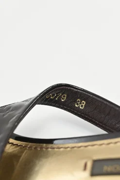 Brown monogram-embossed patent leather No Doubt buckled thong sandals