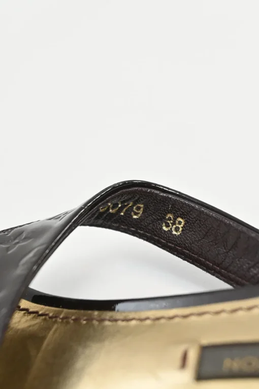 Brown monogram-embossed patent leather No Doubt buckled thong sandals