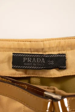 Brown pants with patent leather waistline
