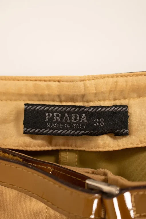 Brown pants with patent leather waistline
