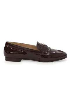Brown patent leather round-toe slip-on penny loafers with gold-tone metallic Coco Mark vamp appliqué