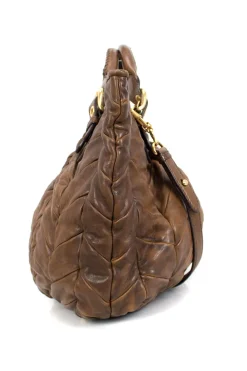 Brown quilted leather top handle bag