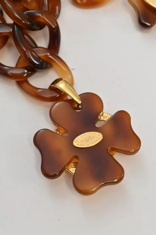 Brown tortoiseshell lucite chunky chain belt with Coco Mark heart and clover charms