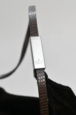 Brown velveteen mini shoulder bag with silver-tone metallic hardware and embossed leather strap