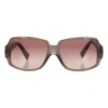 Brown with pink shimmer plastic sunglasses with monogram on temples and pink gradient lenses