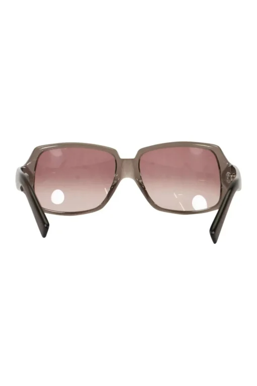 Brown with pink shimmer plastic sunglasses with monogram on temples and pink gradient lenses